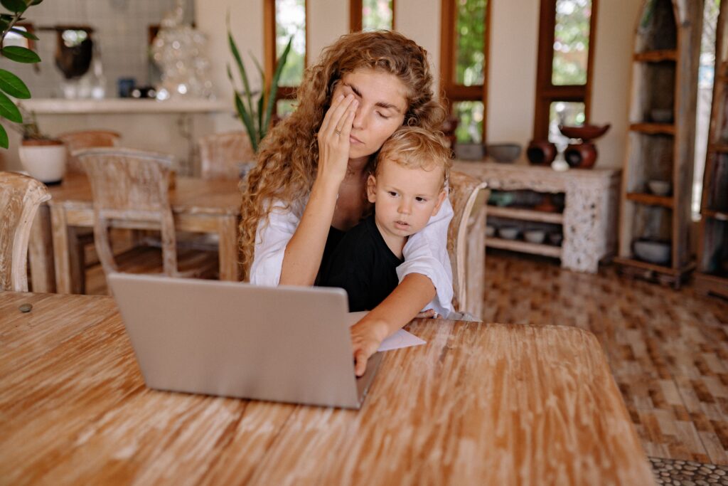 pexels-photo-4458320-4458320 Woman multitasking while working from home with child. Relaxed ambiance.
